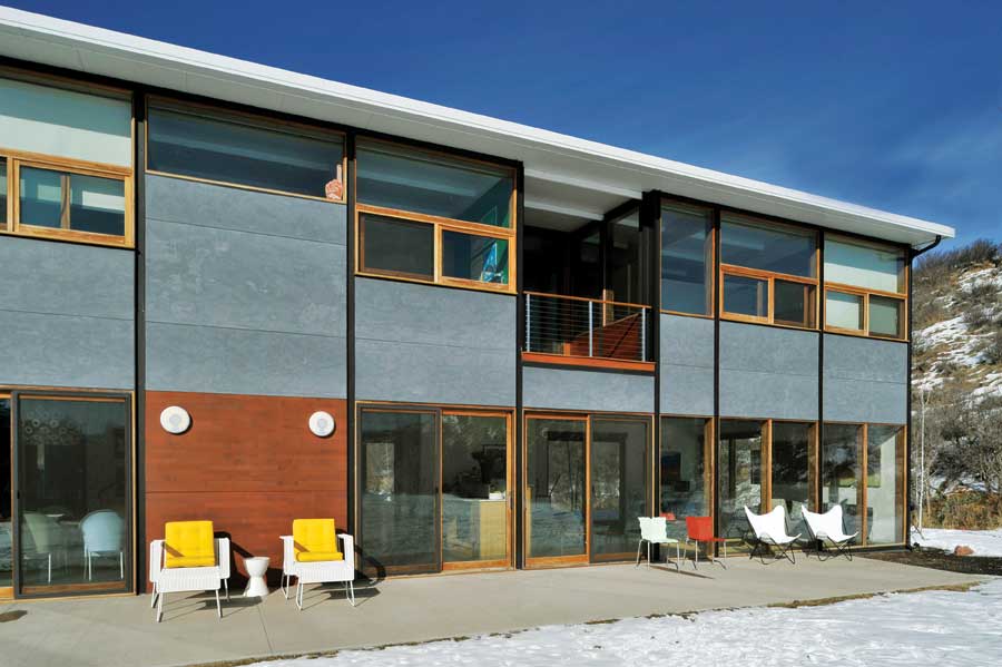 The Grants' sun-drenched patio provides sweeping views down the valley, and multiple windows offer passive heating on cold Aspen days.